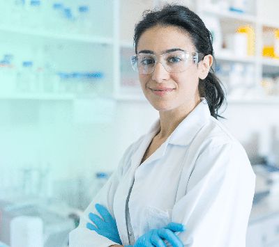 Scientist in lab looking at camera
