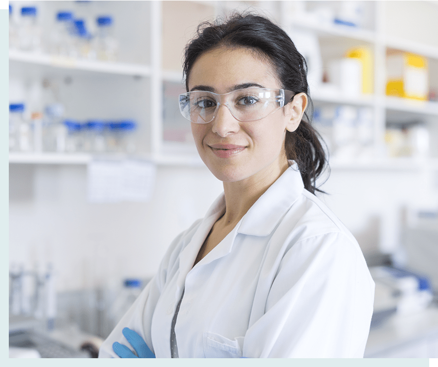 Scientist in lab looking at camera